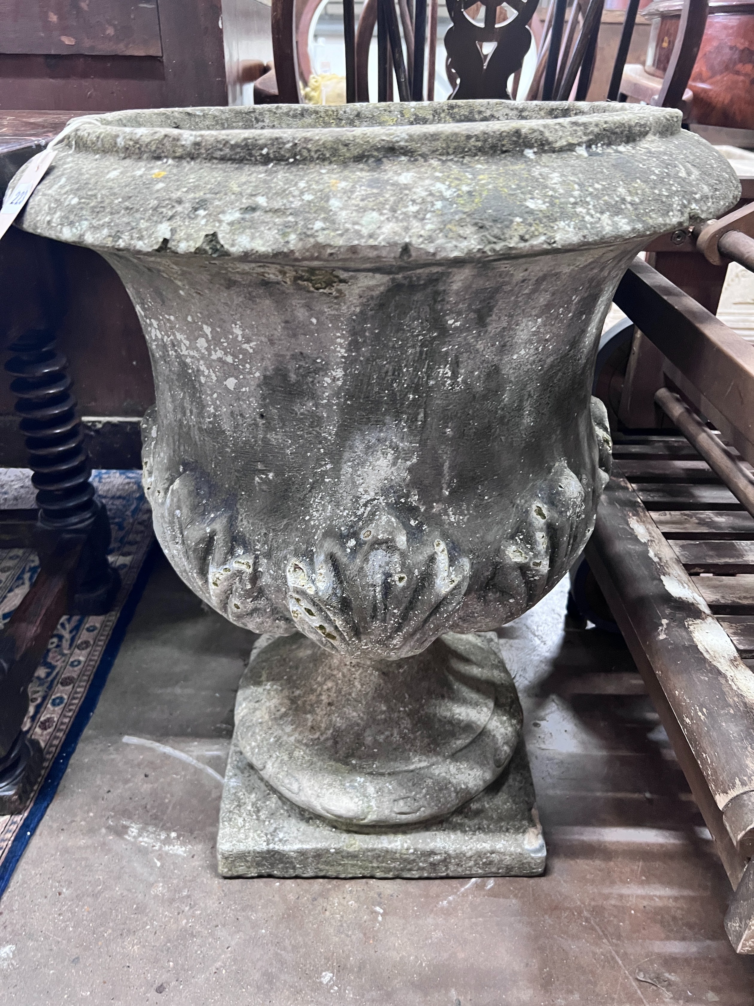 A reconstituted stone garden urn, height 70cm *Please note the sale commences at 9am.